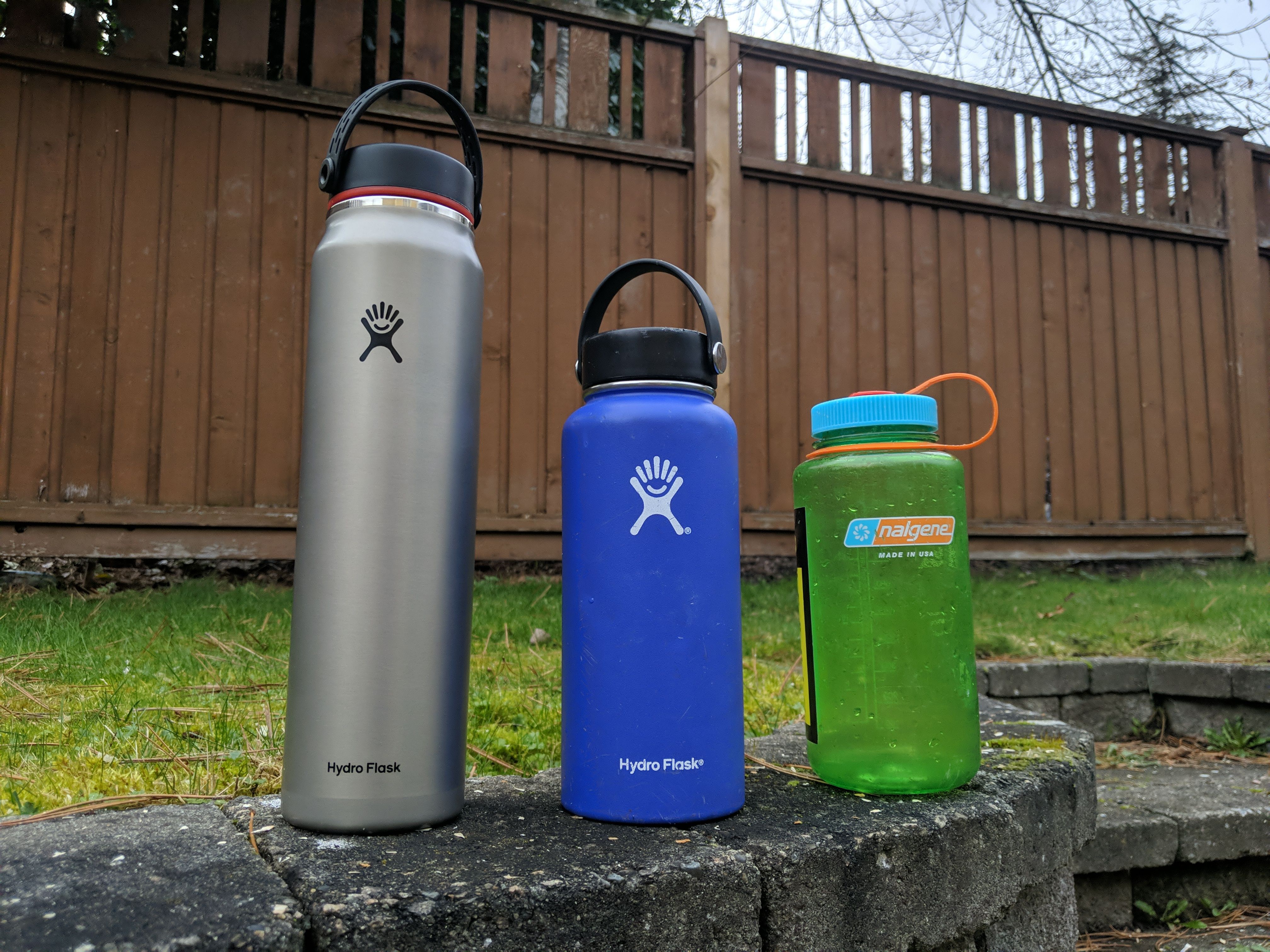 Hydro Flask Trail Series 40oz next to my blue Hydro Flask 32oz and my 1L Nalgene.